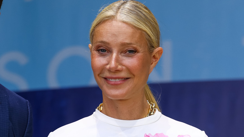 Gwyneth Paltrow white shirt smiling at event