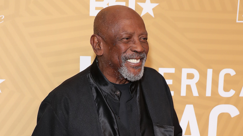 Louis Gossett Jr. black suit shirt smiling at event