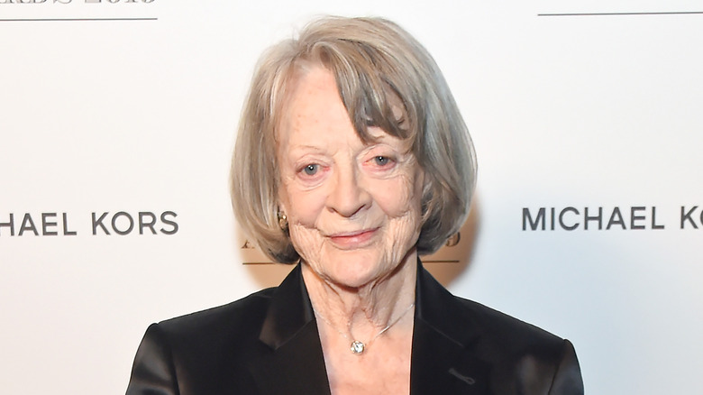 Maggie Smith smiling black jacket at event