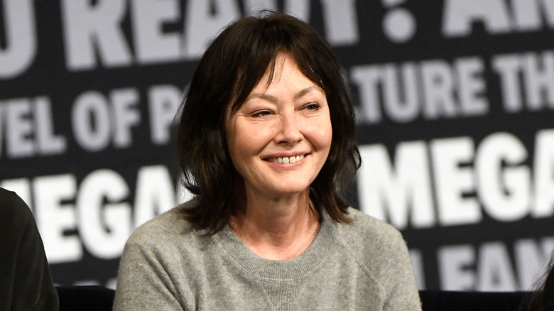 Shannon Doherty smiling grey shirt at event