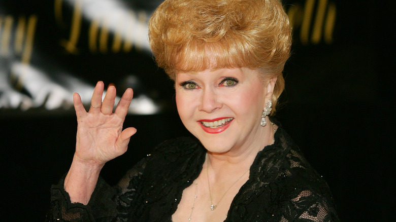 Debbie Reynolds waving at the camera