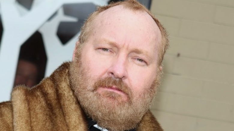 Randy Quaid looking serious