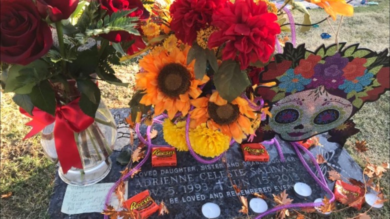 Adrienne Salinas grave stone with flowers