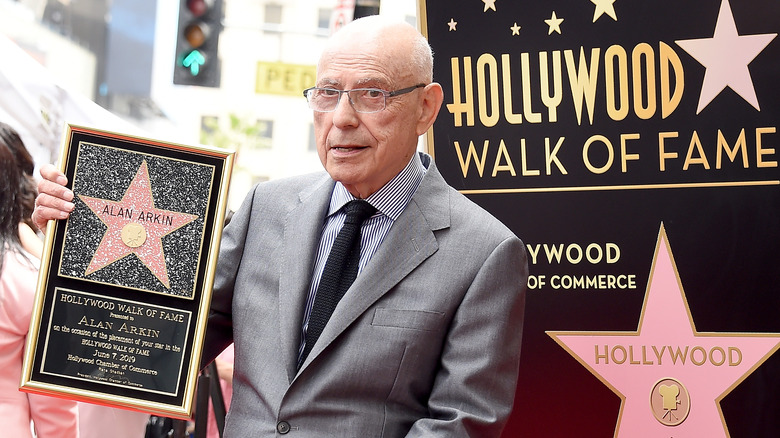 Alan Arkin holding hollywood star