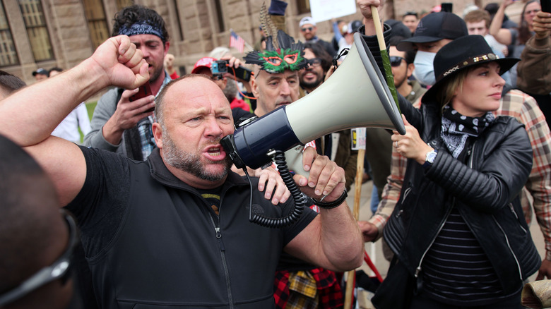 Alex Jones using a megaphone