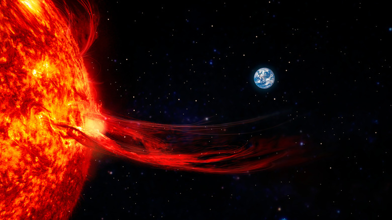 solar flare with earth in background