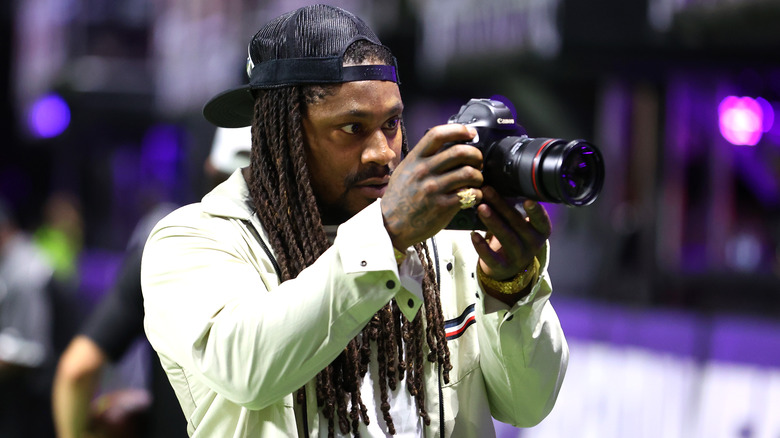 Marshawn Lynch photographing