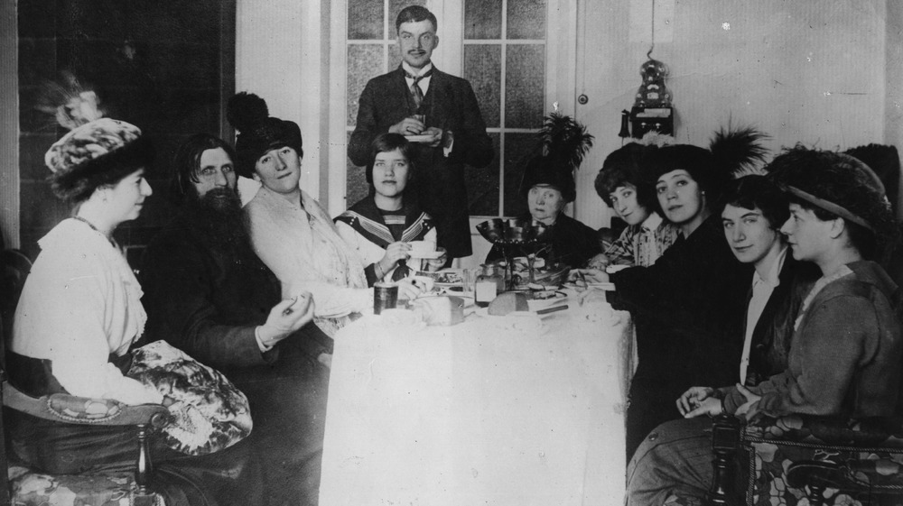 Rasputin at a party with his followers