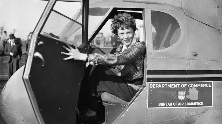 Amelia Earhart sitting in a plane, 1936