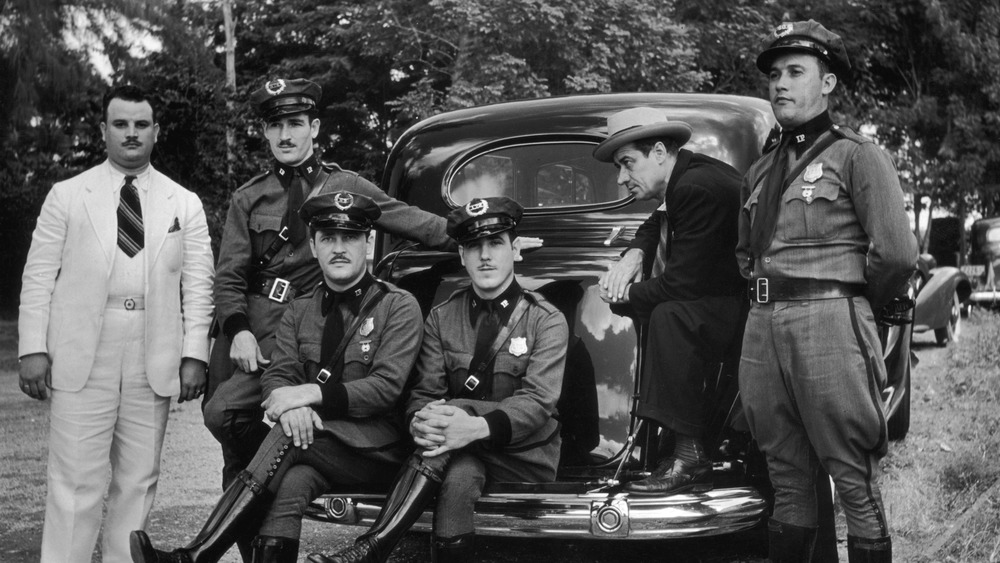 The bodyguards for Puerto Rico's unpopular governor outside of car