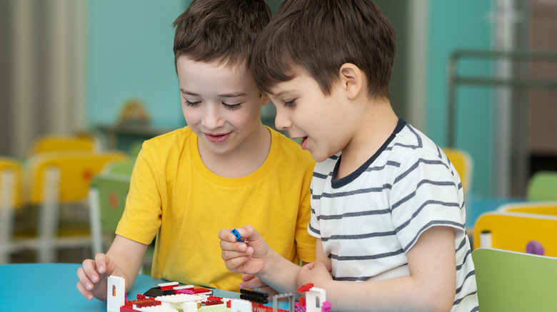 Kindergartners play Legos together