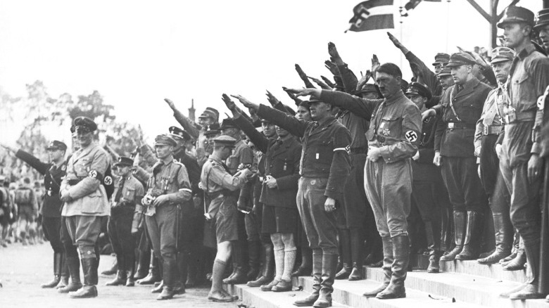 Hitler saluting with soldiers