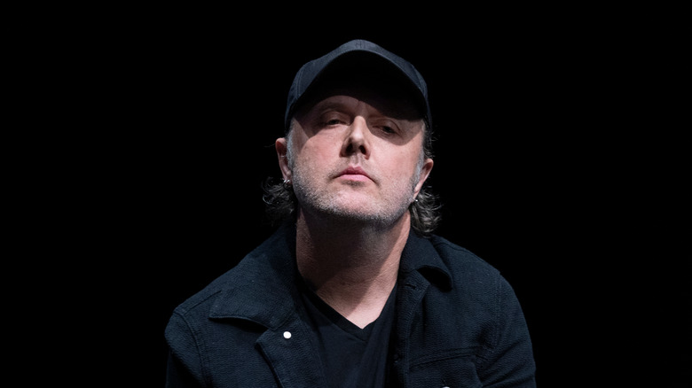 Lars Ulrich wearing black clothes hat