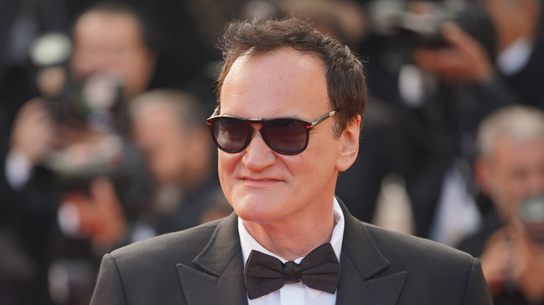 Quentin Tarantino in sunglasses and tuxedo