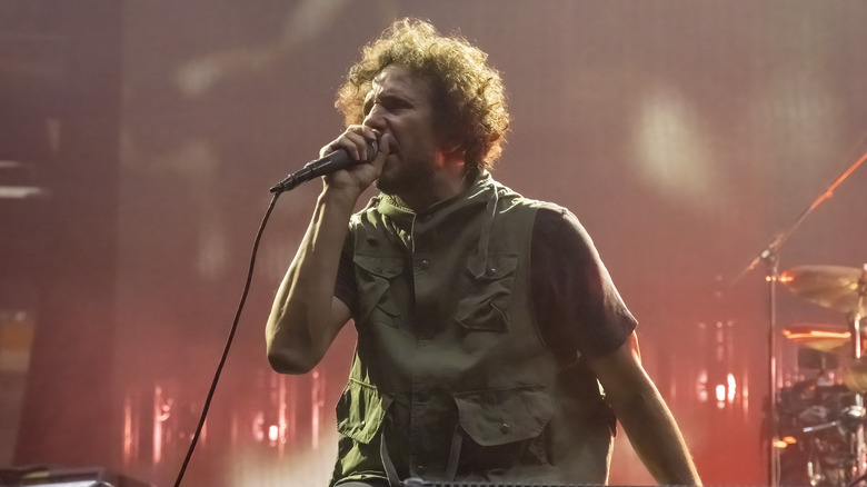 Zack de la Rocha singing into the mic