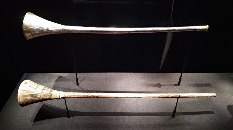 The two of the trumpets of Tutankhamun mounted in a glass case