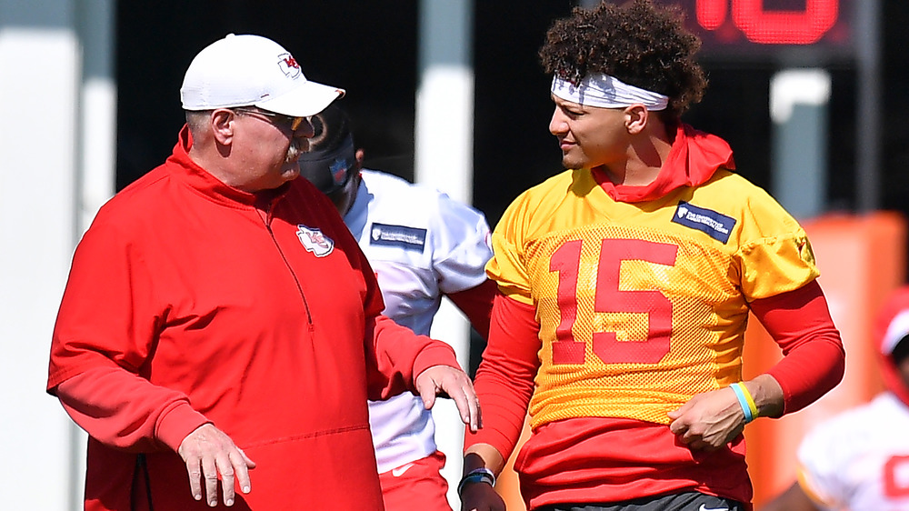 Reid speaking with Patrick Mahomes