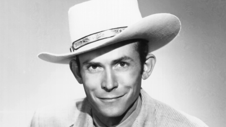 Hank Williams, Sr. posing in a cowboy hat