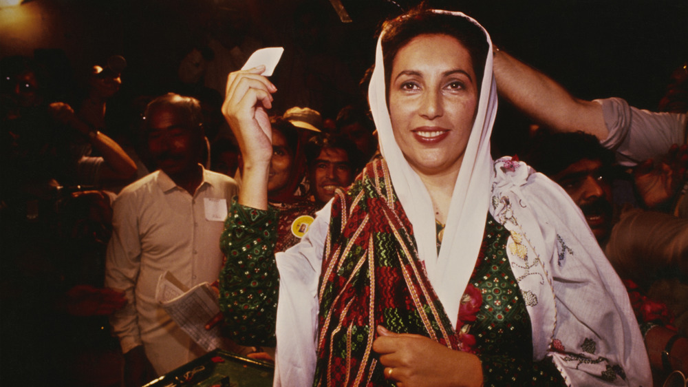 Bhutto with hand in the air