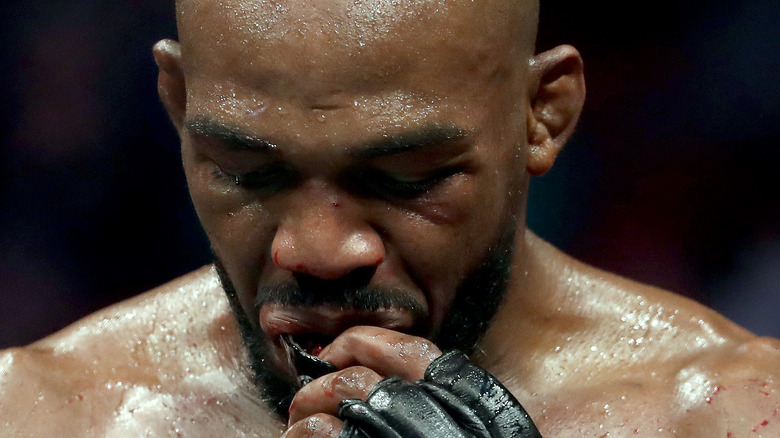 Jon Jones takes out his mouthguard