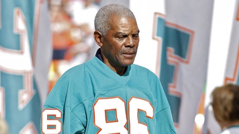 Marlin Briscoe standing on field