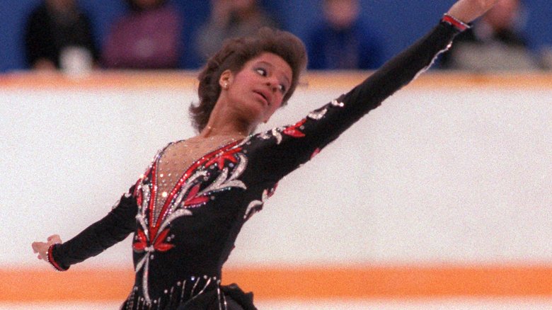 Debi Thomas skating arms open 