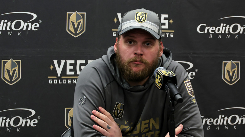 Robin Lehner sitting behind a table arms crossed