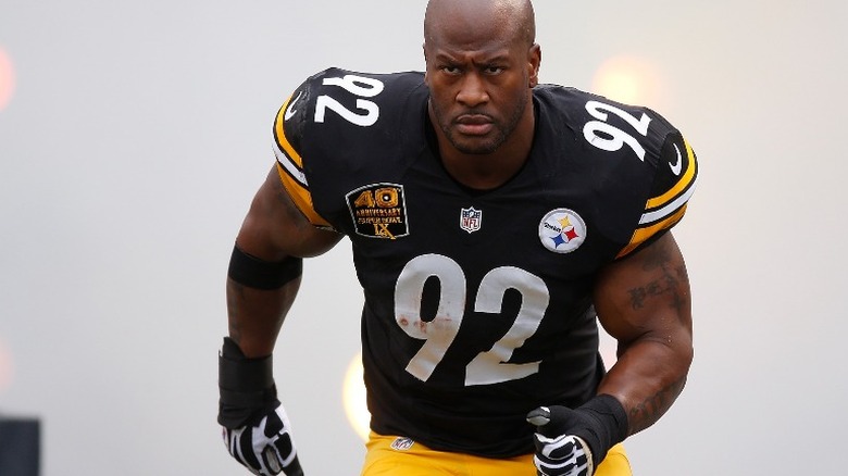 James Harrison running on field