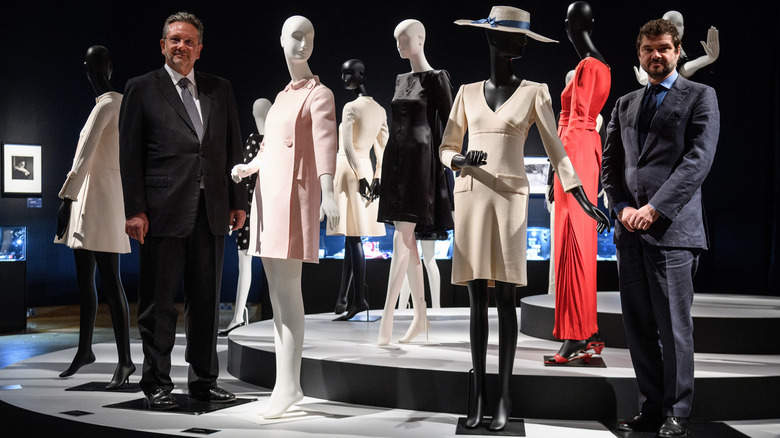 Sean Ferrer and Luca Dotti posing with Audrey Hepburn's dresses