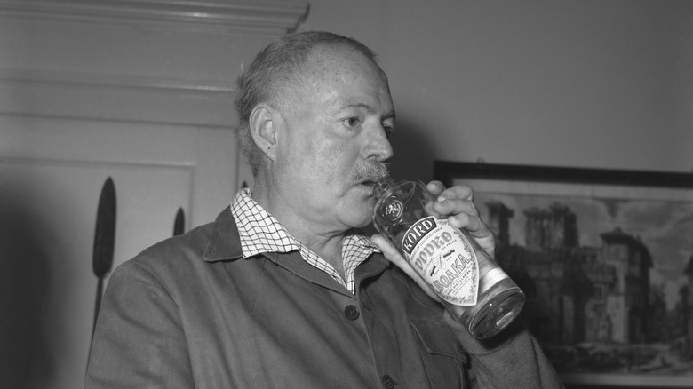 Ernest Hemingway drinking vodka from the bottle