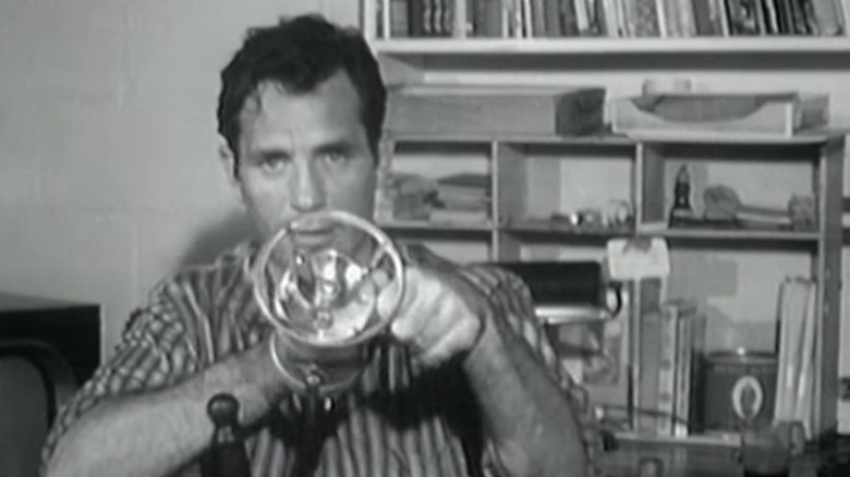 Jack Kerouac in office with railway lamp