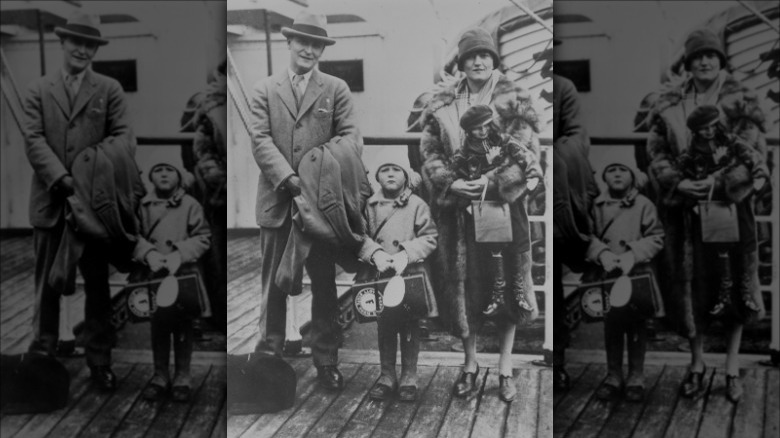 Scott and Zelda Fitzgerald with child on boat