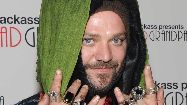 Bam Margera wearing green scarf