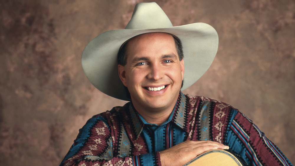 Garth Brooks in white hat smiling