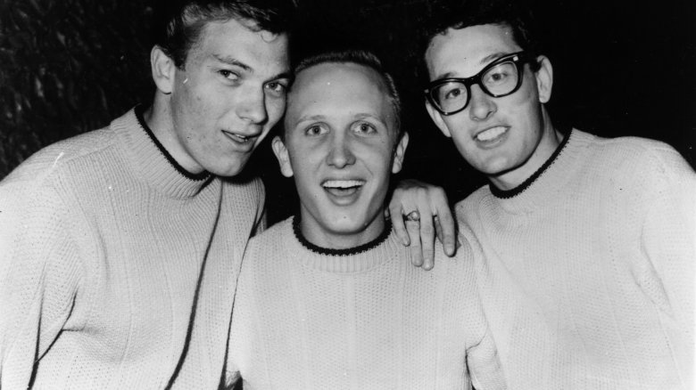 buddy holly and two other preppy boys in a black and white photo