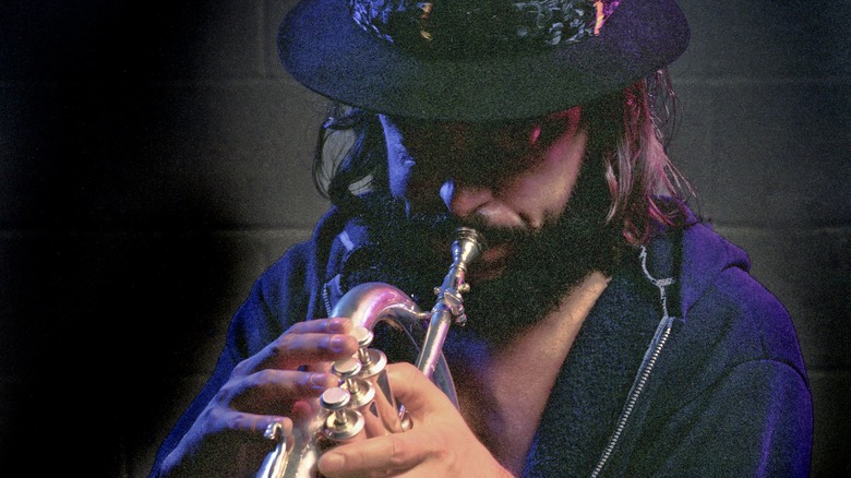 Chuck Mangione playing the flugelhorn in a hat