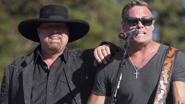 Montgomery Gentry performing outside all in black