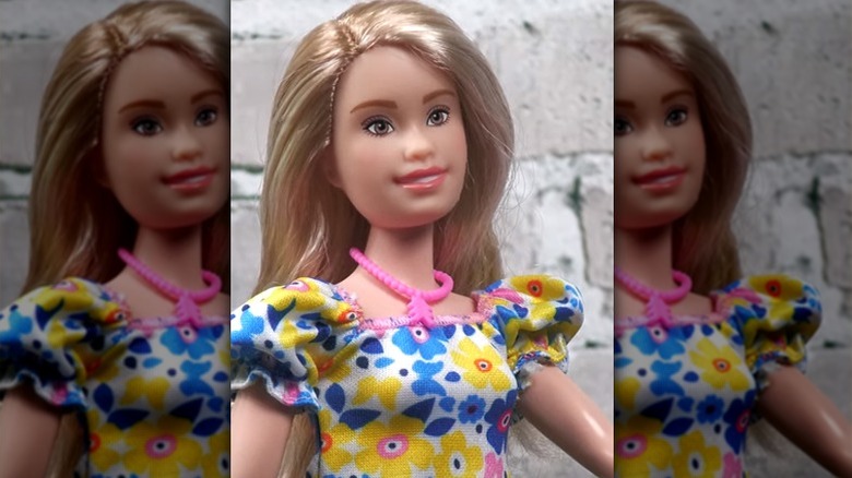 Close-up of a Barbie doll with Down syndrome features