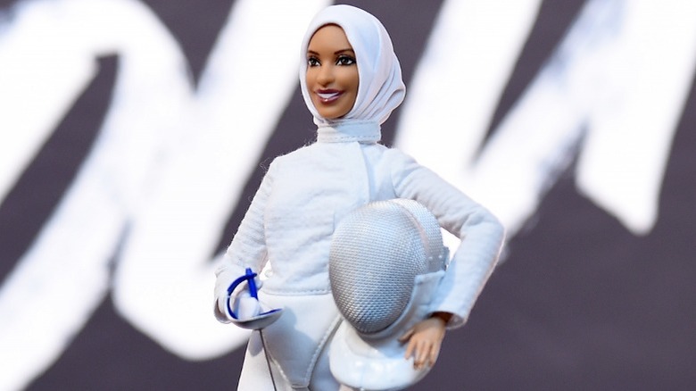 Barbie wearing white fencing gear and a hijab modeled after Ibtihaj Muhammad