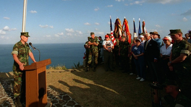 Marine standing at podium speaking