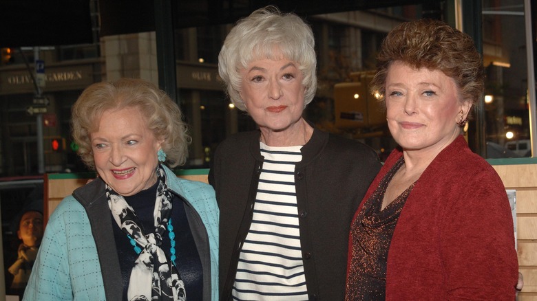 Betty White, Bea Arthur, and Rue McClanahan posing for a photo