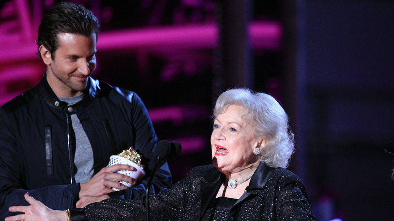 Betty White and Bradley Cooper on stage