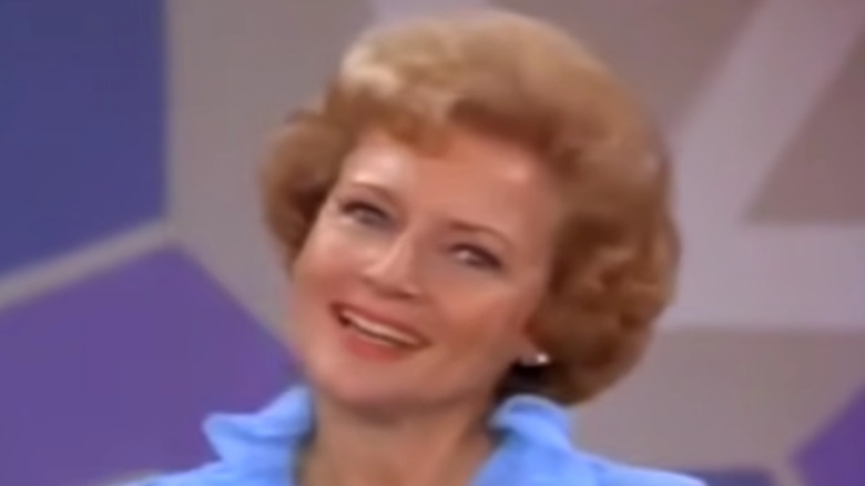 Betty White as Sue Ann Nivens smiling