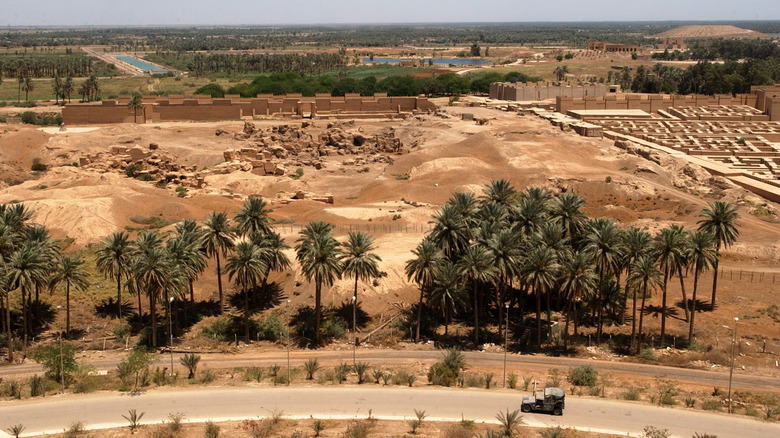 U.S. Military vehicle driving near ruins of Babylon