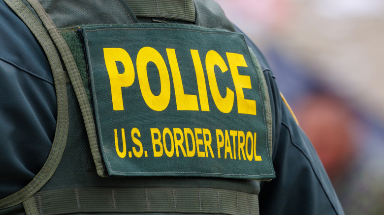 Close up of the back of a U.S. Border Patrol officer's vest