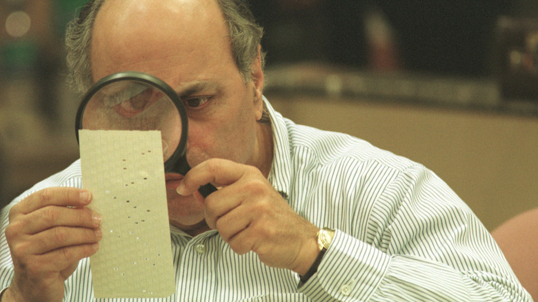 Man examines election ballot 