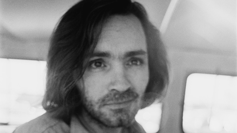 Charles Manson looks up