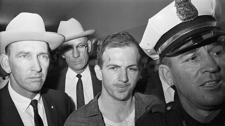 Lee Harvey Oswald with police