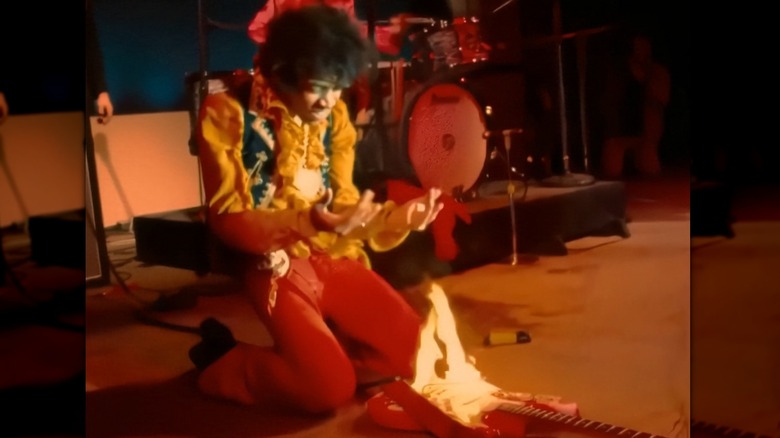 Jimi Hendrix burns his guitar on stage