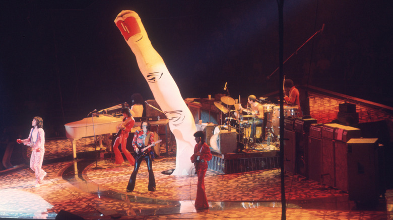 The Rolling Stones play around a giant inflatable finger